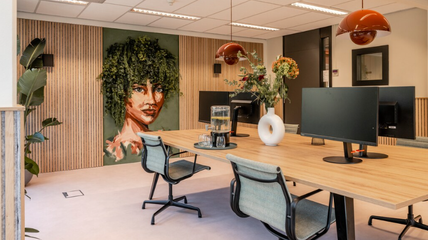 Classic oak, grey felt used in an office space on a wall with a plant and mural in between sections